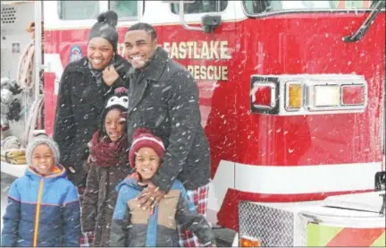  ?? KRISTI GARABRANDT — THE NEWS-HERALD ?? The Wilkins family received a ride in a fire truck from Eastlake Fire Chief Ted Whittingto­n as part of the best Christmas ever event provided the family.