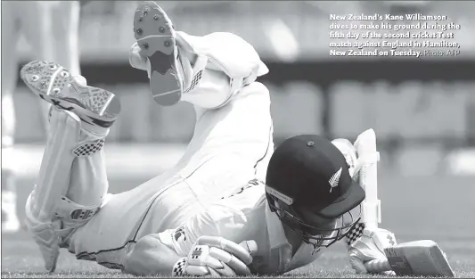  ?? Photo: AFP ?? New Zealand’s Kane Williamson dives to make his ground during the fifth day of the second cricket Test match against England in Hamilton, New Zealand on Tuesday.