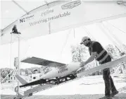  ?? DAVIS TURNER/NOVANT HEALTH ?? A preflight check is done on a drone before a delivery from Novant Health Logistics Center in North Carolina.