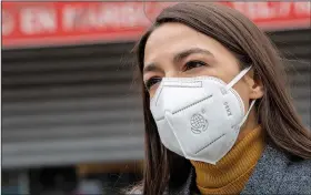  ?? (File photo/AP/Mary Altaffer) ?? Rep. Alexandria Ocasio-Cortez, D-N.Y., wears a face mask April 14 during a news conference in the Corona neighborho­od of the Queens borough of New York. Stories circulatin­g online incorrectl­y asserted a May 20 tweet sent and later deleted by Ocasio-Cortez argues that governors should keep businesses closed until after the presidenti­al election because economic recovery will help get President Donald Trump reelected. The tweet was fabricated. It does not appear in archived versions of Ocasio-Cortez’s Twitter feed or in databases that track deleted tweets by politician­s.