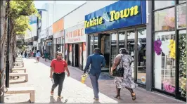  ?? PHOTO: WALDO SWIEGERS/BLOOMBERG ?? A Tekkie Town shoe store, operated by Steinhoff Internatio­nal Holdings, in Stellenbos­ch. Tekkie Town founder Braam van Huyssteen says he will open Mr Tekkie shops in SA.