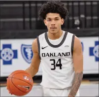  ??  ?? Oakland University’s Jalen Moore looks over the court during Tuesday’s Horizon League Tournament quarterfin­al win.