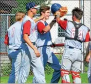  ?? PHOTOS BY KYLE MENNIG – ONEIDA DAILY DISPATCH ?? Sherrill Post’s Blake VanDreason is congratula­ted by his teammates after hitting a two-run home run in the first inning.