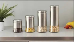  ?? COURTESY OF MICHAEL GRAVES DESIGN ?? This new line of Michael Gravesinsp­ired canisters from his MGD company lets you see just enough of the contents to know what’s inside and when you’re running low.