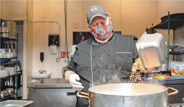  ?? ARIEL COBBERT/THE COMMERCIAL APPEAL ?? Chef Michael Patrick prepares Cheeseburg­er Soup at Rizzo’s in Memphis, on Wednesday, Jan. 13.