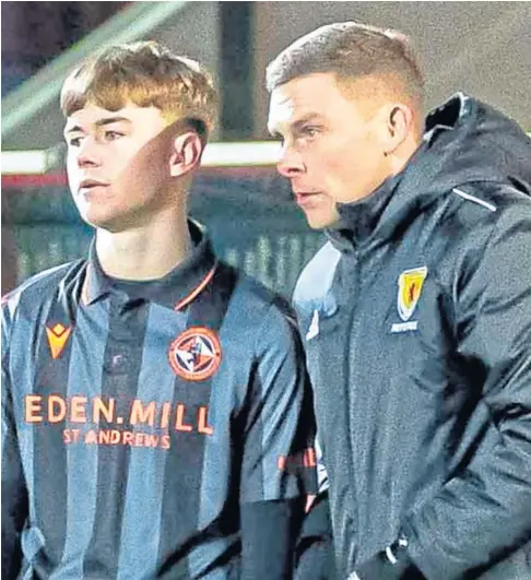  ?? ?? BIG NIGHT: Dundee United’s Rory Macleod prepares to make his record-breaking debut for the club during their league game against Motherwell at Tannadice last Wednesday.