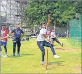  ?? UPCA ?? UP’s chief coach, Obaid Kamal (second from left) monitors proceeding­s at the nets at Vadodara on Monday.