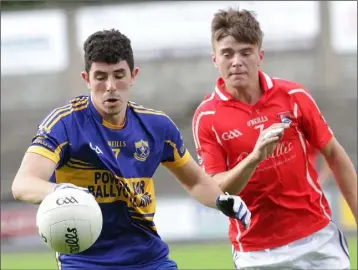  ??  ?? Jack Burford of Gusserane on the ball as Richard Waters (Fethard) closes in.