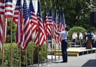  ?? SUSAN WALSH — THE ASSOCIATED PRESS ?? Members of an honor guard prepare flags for a “Celebratio­n of America” event with President Donald Trump on the South Lawn of the White House in Washington, Tuesday. Trump was supposed to host the Philadelph­ia Eagles football team, but he called off a...