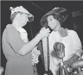  ?? AP ?? First lady Eleanor Roosevelt presents the Spingarn Medal to opera singer Marian Anderson in 1939 in Virginia.