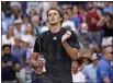  ?? SETH WENIG — THE ASSOCIATED PRESS ?? Alexander Zverev celebrates after winning his match against Jannik Sinner in the fourth round of the U.S. Open on Monday in New York.