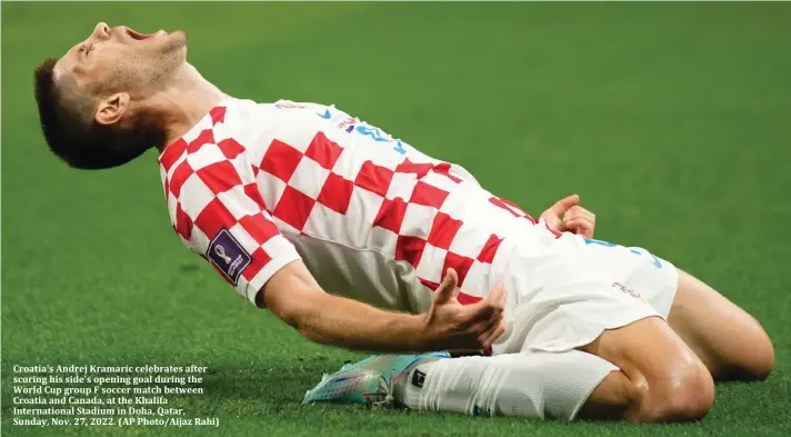  ?? ?? Croatia's Andrej Kramaric celebrates after scoring his side's opening goal during the World Cup group F soccer match between Croatia and Canada, at the Khalifa Internatio­nal Stadium in Doha, Qatar, Sunday, Nov. 27, 2022. (AP Photo/Aijaz Rahi)