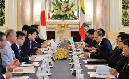  ??  ?? TOKYO: Myanmar’s President Thein Sein (fourth right) and Japan’s Prime Minister Shinzo Abe (fourth left) hold their talks at the Akasaka State Guesthouse in Tokyo yesterday. —AP