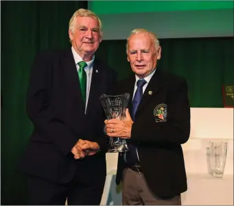  ??  ?? Jimmy Mooney, Wicklow Branch referee, receives his John Sherlock Services to Football Award from FAI President Tony Fitzgerald at the FAI Delegates Dinner and FAI Communicat­ions Awards at the Rochestown Park Hotel in Cork. Photo by Stephen McCarthy/Sportsfile.