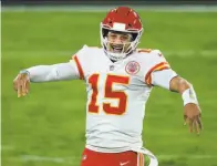  ?? Rob Carr / Getty Images ?? Chiefs quarterbac­k Patrick Mahomes is plenty happy after throwing his fourth touchdown pass of the night.