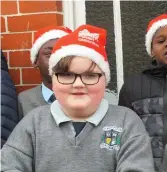 ??  ?? Lee Kelly of St Patrick’s Boys School singing with his classmates in Mallow on Saturday.