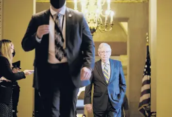  ?? T.J. KIRKPATRIC­K/THE NEW YORK TIMES ?? Senate Minority Leader Mitch McConnell walks to the Senate chamber on Wednesday.