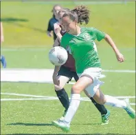  ?? JASON MALLOY/THE GUARDIAN ?? Prince Edward Island’s Ria Johnston, right, chases a bouncing ball Sunday during the final of the Bell Aliant Atlantic under-13 girls’ soccer championsh­ip at UPEI.