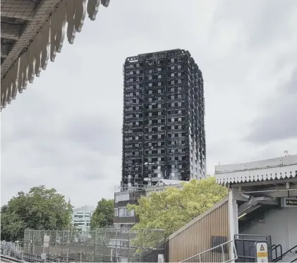  ??  ?? 0 The ruin of Grenfell Tower has become ‘a byword for all that has gone wrong with Britain’s housing provision’