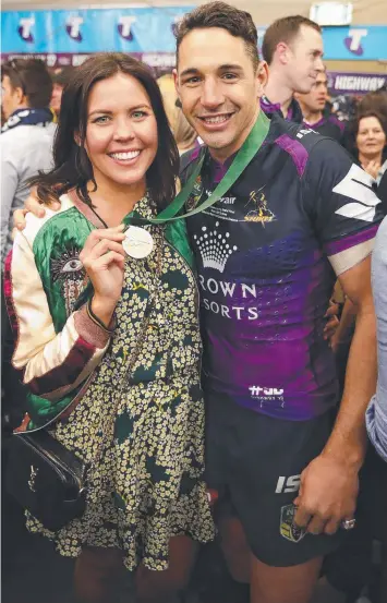  ?? Picture: BRETT COSTELLO ?? WILL HE PLAY ON: Melbourne's Billy Slater and wife Nicole after the Storm’s grand final win against the Cowboys on Sunday. Now speculatio­n has turned to his club career.