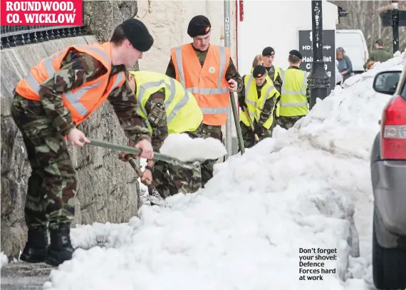  ??  ?? Don’t forget your shovel: Defence Forces hard at work