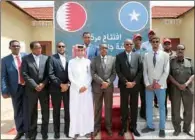  ??  ?? Somalia’s Prime Minister Mohamed Hussein Roble and Qatari Ambassador to Somalia HE Hassan bin Hamza Hashem with officials of Somalia and QC during the inaugurati­on of the multi-service centre.
