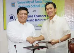  ??  ?? UST Rector Rev. Fr. Herminio V. Dagohoy (left), O.P., and PCCI President former Ambassador Alfredo M. Yao shake hands after signing the Memorandum of Agreement between the two institutio­ns that formalizes the contract for the UST Graduate School to...