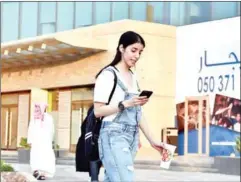  ?? AFP ?? Saudi Manahel al-Otaibi, a 25-year-old activist, walks in western clothes in the Saudi capital Riyadh’s al Tahliya street.