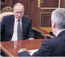  ??  ?? STRAINED Pressure shows on Putin at meeting in Moscow yesterday