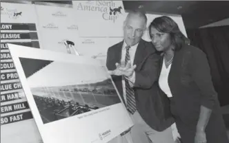  ?? GRAHAM PAINE, METROLAND ?? Woodbine Entertainm­ent CEO Jim Lawson, left, shows Halton MPP Indira Naidoo-Harris the more than $10 million in improvemen­ts and upgrades announced for Mohawk Racetrack.