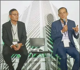  ??  ?? Schneider Electric president for East Asia and Japan Tommy Leong (left), Schneider Electric chairman and CEO Jean-Pascal Tricoire talk to media during the Innovation Summit in Singapore.