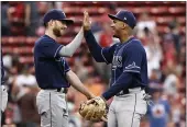  ?? WINSLOW TOWNSON — THE ASSOCIATED PRESS ?? Tampa Bay Rays’ Wander Franco, right, celebrates with relief pitcher Collin McHugh after they defeated the
Red Sox in 10innings Monday at Fenway Park in Boston.