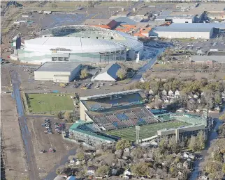  ?? TROY FLEECE ?? With the new Mosaic Stadium, background, up and running, the Saskatchew­an Roughrider­s will look to host a Grey Cup in the near future after the 2013 CFL title game was played in the old Mosaic Stadium.