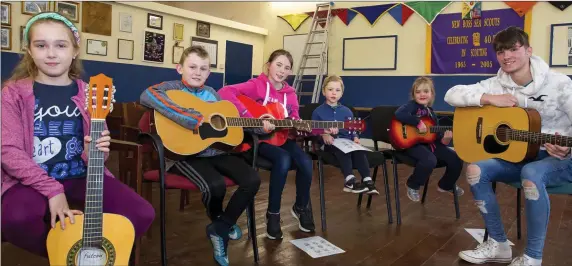  ??  ?? Ricky Gaynor teaching guitar at the start of Trad house New Ross in the scout hall.