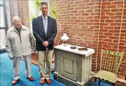  ?? BOB KEELER — DIGITAL FIRST MEDIA ?? Merrill Yoder, left, and the Rev. Scott Nice, senior pastor of Christ Reformed Church of Indian Creek, stand beside the altar and a pulpit chair from the church’s 1826 building. The church, which was started in 1746, is celebratin­g its 270th...