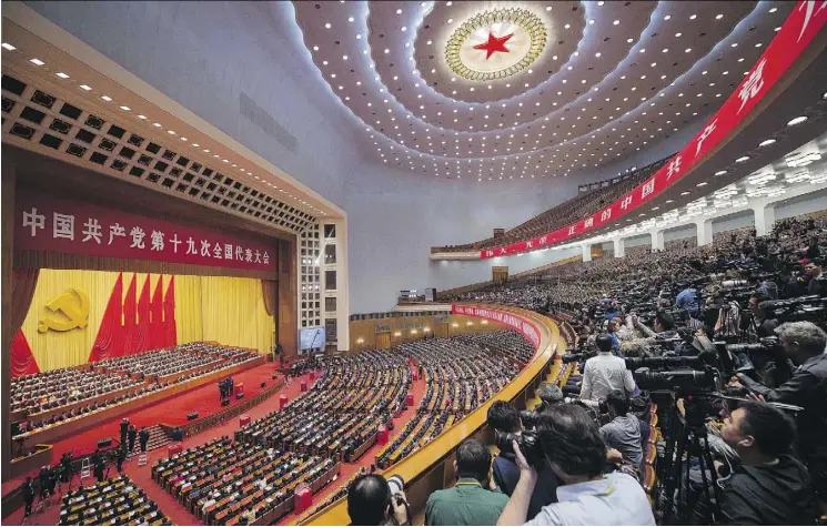  ?? NICOLAS ASFOURI/AFP/GETTY IMAGES ?? Delegates attend the closing of the 19th National Congress of the Communist Party of China at the Great Hall of the People in Beijing on Tuesday. While the party sent a clear message of political consolidat­ion with more power bestowed on Chinese...