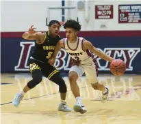  ?? AMY SHORTELL/THE MORNING CALL ?? Liberty’s Blake Hargrove drives past Freedom’s Jalen Fletcher in the Hurricanes’ win Friday night.