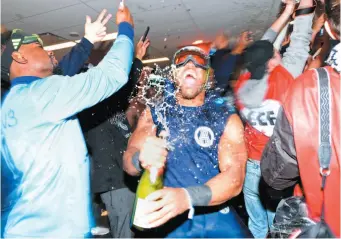  ?? CP PHOTO ?? Toronto Argonauts linebacker Nakas Onyeka celebrates in the locker room after his team defeated the Calgary Stampeders in the 105th Grey Cup on Sunday in Ottawa.