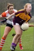  ??  ?? Grace Cloney of Wexford handpasses as Armagh’s Caroline O’Hanlon moves in during the league clash on Sunday.