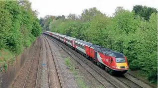  ?? PAUL A BIGGS ?? The first ex-LNER red livery HST set has entered service, replacing the non-compliant East Midlands Railway sets. Prior to introducti­on in early May, test runs were undertaken, and on April 18, power cars Nos. 43316 and 43320 pass Sutton Bonington with SZS, 11.04 Neville Hill-Neville Hill via Leicester test run.