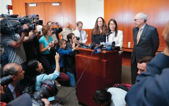  ??  ?? Sharing the message Pao and her legal team speak to the press at the conclusion of her lawsuit in March 2015.