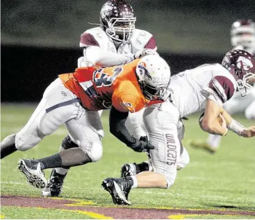  ?? Eric Christian Smith / For the Chronicle ?? Bush graduate Ola Adeniyi, left, finished his high school career with a performanc­e at the Bayou Bowl this past weekend and will be heading to the University of Toledo this fall.