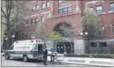  ?? JOHN MINCHILLO ?? FILE - In this April 17, 2020, file photo, emergency medical workers arrive at Cobble Hill Health Center in the Brooklyn borough of New York. New York
