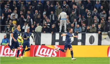  ?? (Massimo Pinca/Reuters) ?? MANCHESTER UNITED’S Juan Mata celebrates scoring the team’s first goal in Wednesday’s Champions League match against Juventus.