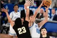  ?? MaCabe Brown / Associated Press ?? Nova Southeaste­rn's Will Yoakum goes up for a shot against West Liberty's Alek West (23). Yoakum finished with 31 points.