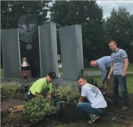  ?? SUBMITTED PHOTO ?? Local 98 volunteers install LED flood lights at Firefighte­r Memorial on Conshohock­en Road. (Submitted photo)