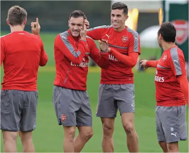  ?? GETTY IMAGES ?? Prime mates: Lucas Perez (second from left) and Gabriel share a joke during training