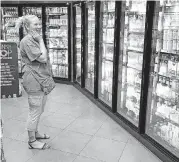  ?? GILBERT, TULSA WORLD VIA AP] [PHOTO BY TOM ?? Amber Fiddler shops at a QuikTrip in Tulsa.