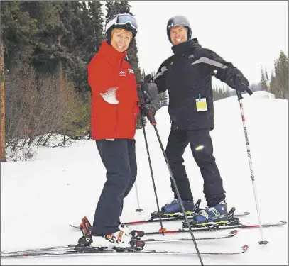  ?? Kyle taylor photo ?? Olympic champion Nancy Greene gives writer Steve MacNaull a few tips before they race on the new ski and snowboard cross course at Sun Peaks Resort near Kamloops, B.C.
