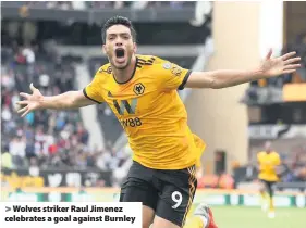  ??  ?? &gt; Wolves striker Raul Jimenez celebrates a goal against Burnley